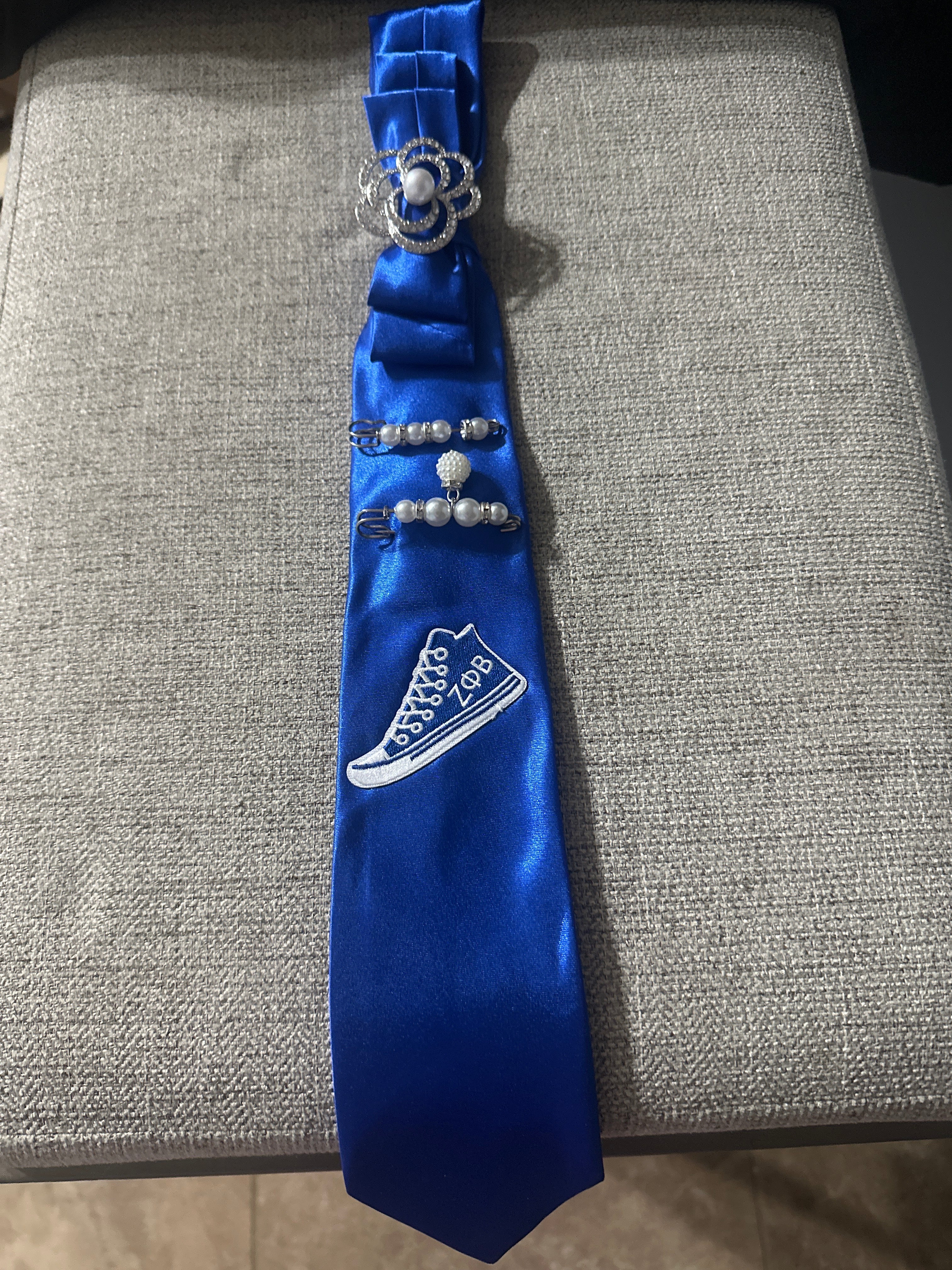 JLJ Signature Ties with pearl necklace