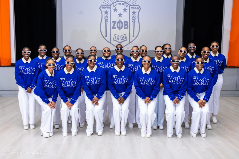 JLJ clients wearing coordinated royal blue apparel and signature pearl collars