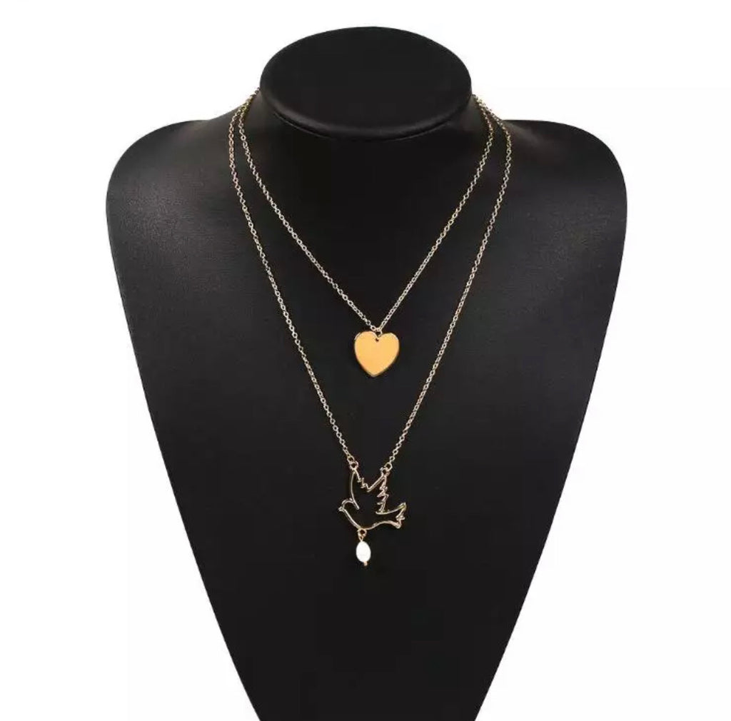1 pearl & dove gold colored necklace